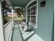Relaxing front porch with seating offers a peaceful outdoor retreat at 11371 Perico Isle Cir, Bradenton, FL 34209