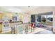 Eat-in kitchen with granite counters, stainless appliances and access to a screened lanai overlooking the water at 11371 Perico Isle Cir, Bradenton, FL 34209