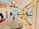 Kitchen with granite counters and island bar for extra seating and food prep space at 11371 Perico Isle Cir, Bradenton, FL 34209