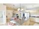 Bright eat-in kitchen features updated appliances, light wood cabinets, and granite countertops at 11371 Perico Isle Cir, Bradenton, FL 34209