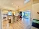 Open kitchen with an island, and stainless steel appliances perfect for cooking and entertaining at 11371 Perico Isle Cir, Bradenton, FL 34209