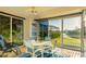 Screened Lanai featuring a ceiling fan and views of the water and surrounding landscape at 11371 Perico Isle Cir, Bradenton, FL 34209