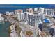 High-rise condos by the water, showcasing modern architecture near a well-maintained roadway and scenic surroundings at 1155 N Gulfstream Ave # 1205, Sarasota, FL 34236