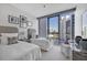 Comfortable bedroom with twin beds, city views, and bright natural light at 1155 N Gulfstream Ave # 1205, Sarasota, FL 34236