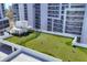 Rooftop dog park offers a convenient green space for pets with building views at 1155 N Gulfstream Ave # 1205, Sarasota, FL 34236