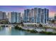 Modern high-rise condominiums boast sleek architecture and stunning waterfront views at 1155 N Gulfstream Ave # 1205, Sarasota, FL 34236