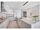 Elegant kitchen with stainless steel appliances, custom cabinets, and breakfast bar seating with an open layout at 1155 N Gulfstream Ave # 1205, Sarasota, FL 34236
