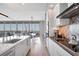 Modern kitchen featuring sleek white cabinets, stainless steel appliances, and an open layout for entertaining at 1155 N Gulfstream Ave # 1205, Sarasota, FL 34236
