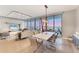 Open concept living room features floor-to-ceiling windows with beautiful views and modern furnishings at 1155 N Gulfstream Ave # 1205, Sarasota, FL 34236