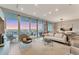 Contemporary condo living room featuring expansive windows with breathtaking bay and city views at 1155 N Gulfstream Ave # 1205, Sarasota, FL 34236