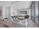 Modern living room with sleek furnishings, stylish decor, and expansive windows offering water views at 1155 N Gulfstream Ave # 1205, Sarasota, FL 34236