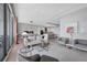 Bright, open-concept living space with floor-to-ceiling windows offering panoramic city and water views at 1155 N Gulfstream Ave # 1205, Sarasota, FL 34236
