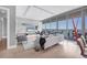 Open-concept living area with spectacular views through expansive windows, creating a serene atmosphere at 1155 N Gulfstream Ave # 1205, Sarasota, FL 34236