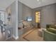 Modern living room featuring a wet bar, sleek furniture, and stylish decor in a neutral color palette at 1155 N Gulfstream Ave # 1205, Sarasota, FL 34236