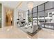 Bright and airy lobby area featuring neutral furniture, tile floors, a modern chandelier, and oversized windows at 1155 N Gulfstream Ave # 1205, Sarasota, FL 34236