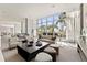 Spacious lounge area featuring a modern design, comfortable seating, and expansive water views at 1155 N Gulfstream Ave # 1205, Sarasota, FL 34236