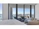 Spacious main bedroom boasting panoramic water views and a cozy daybed for relaxing near the balcony at 1155 N Gulfstream Ave # 1205, Sarasota, FL 34236