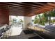 Outdoor kitchen features stainless steel grill, bar seating, and views of the ocean at 1155 N Gulfstream Ave # 1205, Sarasota, FL 34236