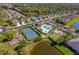 Aerial view of the community pool, spa, tennis courts, and other amenities at 12140 Whisper Lake Dr, Bradenton, FL 34211