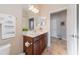 Bathroom boasts single sink vanity, tiled floors, and decorative towels at 12140 Whisper Lake Dr, Bradenton, FL 34211