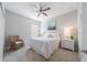 Bright bedroom featuring neutral walls, overhead fan and picture window at 12140 Whisper Lake Dr, Bradenton, FL 34211