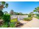 Well-maintained dog park with lush landscaping and sign designating it as a 'Rover Run' at 12140 Whisper Lake Dr, Bradenton, FL 34211