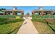 Community entrance featuring covered shelters and manicured landscaping at 12140 Whisper Lake Dr, Bradenton, FL 34211