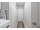 Hallway features tiled floors, neutral paint, a storage closet, and a utility closet at 12140 Whisper Lake Dr, Bradenton, FL 34211