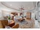 Open-concept living room with a view into the kitchen and an elegant interior design at 12140 Whisper Lake Dr, Bradenton, FL 34211