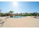 Stunning community pool area with covered pavilions, seating, and lush landscaping at 12140 Whisper Lake Dr, Bradenton, FL 34211