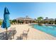 Attractive community pool area featuring shade pavilions and comfortable lounge seating at 12140 Whisper Lake Dr, Bradenton, FL 34211