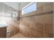 Shower features tile walls, with built in shelves and window bringing natural light at 12140 Whisper Lake Dr, Bradenton, FL 34211