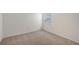 Cozy bedroom with soft carpeting, a window, and white walls, creating a calming atmosphere at 13026 Bayberry Way, Parrish, FL 34219