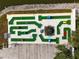 Aerial shot of the putt putt golf course, showcasing its colorful design and scenic placement near a water feature at 135 Oakwood Ln, Sarasota, FL 34237