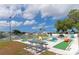 Fun mini golf course next to a serene pond. Perfect for outdoor recreation and Gathering entertainment at 135 Oakwood Ln, Sarasota, FL 34237