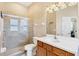 Modern bathroom featuring a glass-enclosed shower and a single sink vanity at 1365 Western Pine Cir, Sarasota, FL 34240