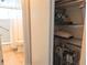 Hallway view of a bathroom with a tub/shower combination and nearby storage closet at 1531 Pleasant Rd # H-3, Bradenton, FL 34207