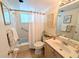 Bathroom featuring a shower-tub combo, vanity with sink, and tiled floors at 1531 Pleasant Rd # H-3, Bradenton, FL 34207