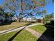 Well-maintained community grounds showcasing mature trees and manicured lawns, creating a serene atmosphere at 1531 Pleasant Rd # H-3, Bradenton, FL 34207