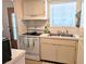 Well-maintained kitchen featuring white appliances, ample counter space, and natural light at 1531 Pleasant Rd # H-3, Bradenton, FL 34207