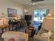 Comfortable condo living room with stylish furnishings, a ceiling fan, and access to the screened patio at 1531 Pleasant Rd # H-3, Bradenton, FL 34207