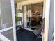 Cozy screened patio featuring comfortable seating, opening to a bright living area through sliding glass doors at 1531 Pleasant Rd # H-3, Bradenton, FL 34207