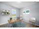 Simple office space with a desk, chair, and plenty of natural light at 16039 Dinal Dr, Punta Gorda, FL 33955