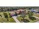 Expansive aerial view of the home with lush landscaping, long driveway, and well-manicured lawn at 17809 Howling Wolf Run, Parrish, FL 34219