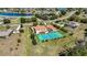 Beautiful home with manicured lawn, tennis court, screened in pool, and close proximity to a scenic lake at 17809 Howling Wolf Run, Parrish, FL 34219