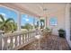 Charming balcony with brick floors and a view, perfect for relaxing in the outdoors at 17809 Howling Wolf Run, Parrish, FL 34219