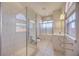 Large bathroom features a glass shower, bathtub, vanity, bidet, and lots of natural light at 17809 Howling Wolf Run, Parrish, FL 34219