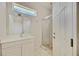 Bathroom featuring a glass door shower, sink and plenty of storage space at 17809 Howling Wolf Run, Parrish, FL 34219
