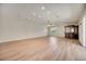 Large bonus room with bar, hardwood flooring, recessed lighting, and a bright window at 17809 Howling Wolf Run, Parrish, FL 34219