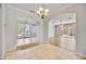 Inviting entryway with tile flooring, arched doorways, and views of the front entrance and pool area at 17809 Howling Wolf Run, Parrish, FL 34219